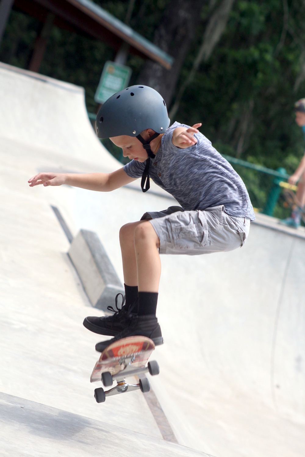 Nine year old Tyler Gold checked out a molly on the back side of the OP Skate Park course.